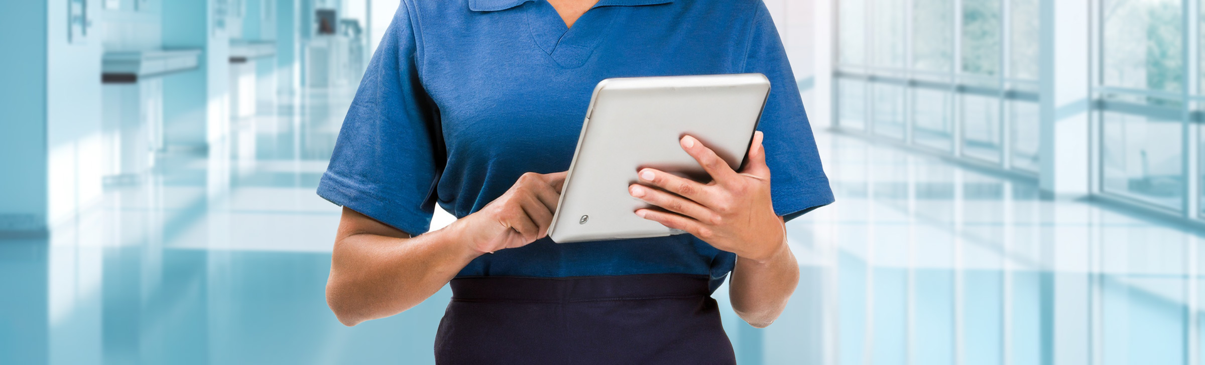 Woman holding tablet in hospital